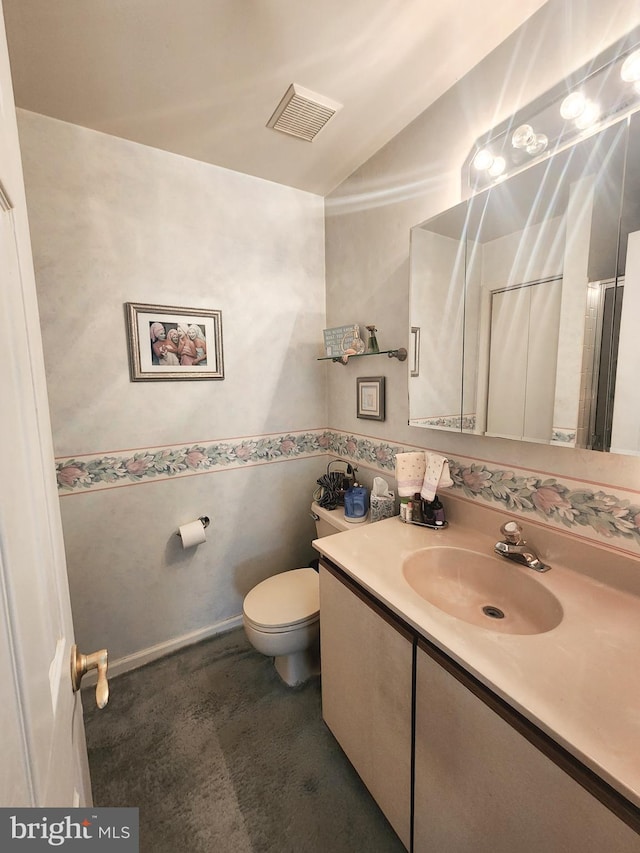 bathroom with vanity and toilet