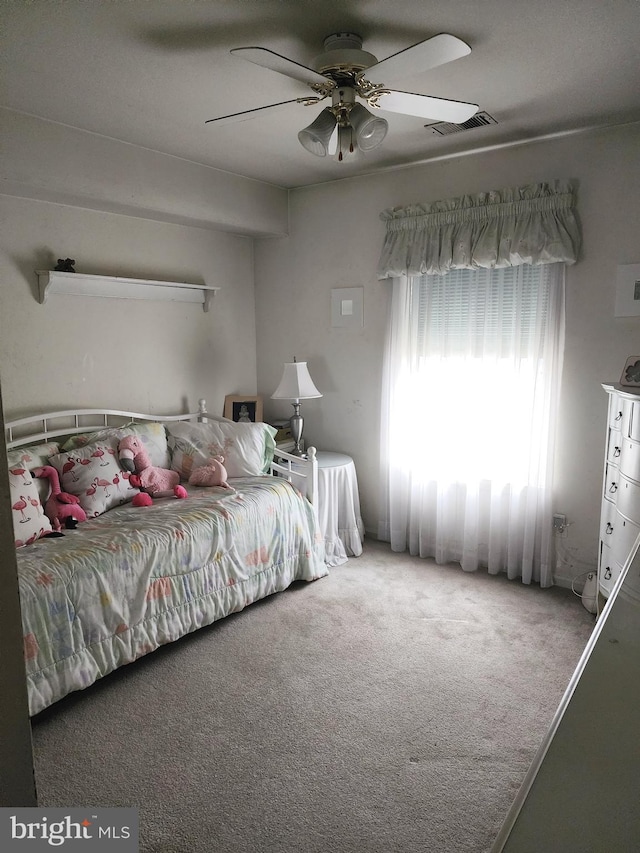 carpeted bedroom with ceiling fan