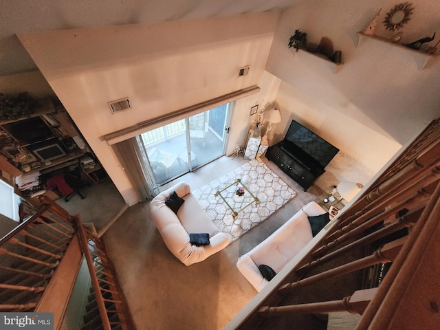 living room with a towering ceiling