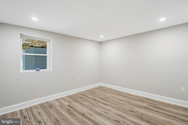 spare room with light wood-type flooring