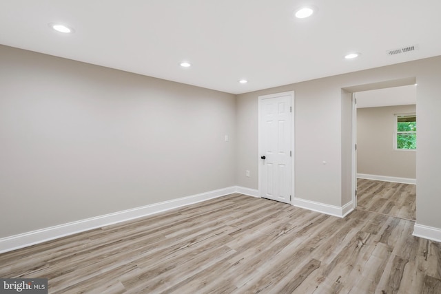 unfurnished room with light hardwood / wood-style floors