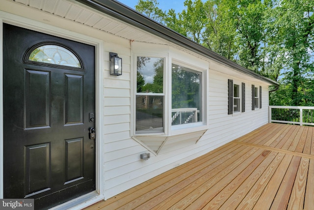 doorway to property featuring a deck