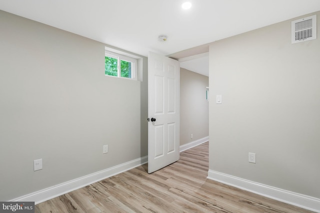 basement featuring light wood-type flooring