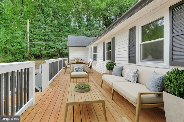 wooden terrace featuring outdoor lounge area