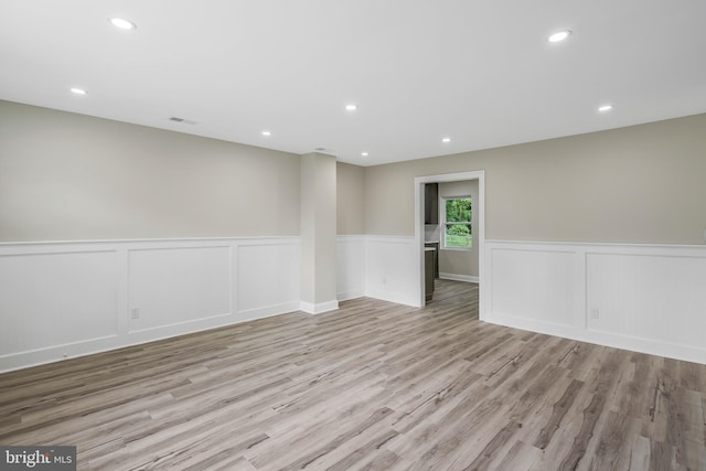 unfurnished room featuring light hardwood / wood-style floors