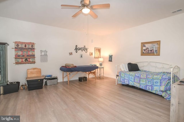 bedroom featuring hardwood / wood-style floors and ceiling fan