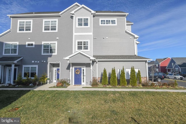 view of front of property with a front lawn