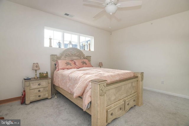 bedroom featuring light colored carpet and ceiling fan