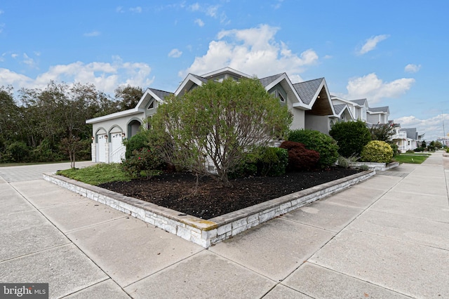 view of property exterior featuring a garage