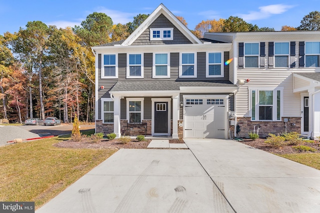 view of front of home featuring a front lawn and a garage