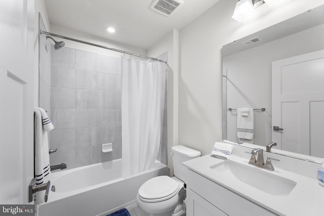 full bathroom with toilet, shower / bath combo with shower curtain, and vanity