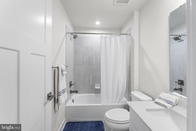 full bathroom with vanity, shower / bath combo, toilet, and tile patterned flooring