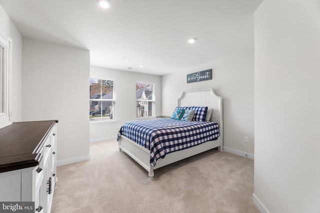 bedroom with light colored carpet