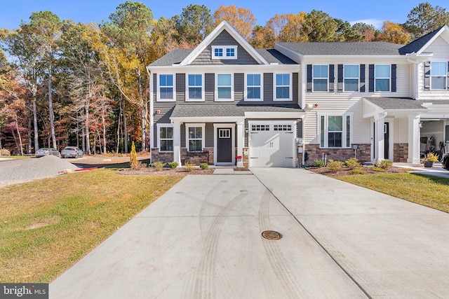 view of front of home featuring a front yard and a garage