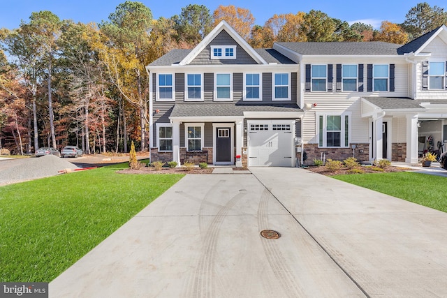 view of front of house featuring a front lawn and a garage