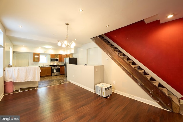 interior space featuring dark hardwood / wood-style floors and a chandelier