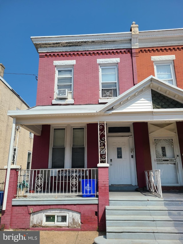 townhome / multi-family property with covered porch