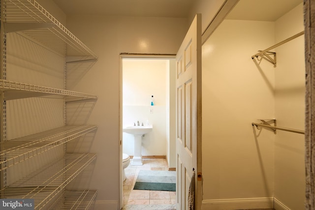 walk in closet with sink