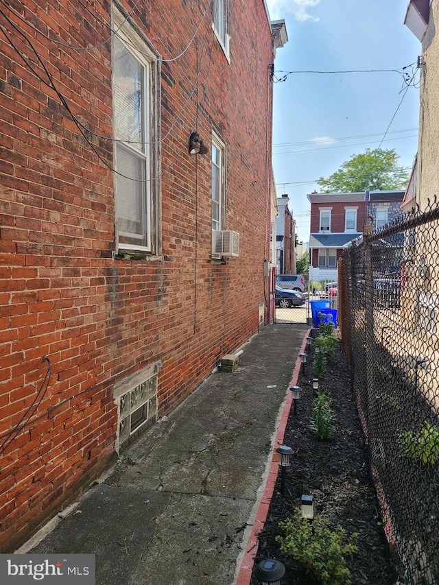 view of side of home with cooling unit