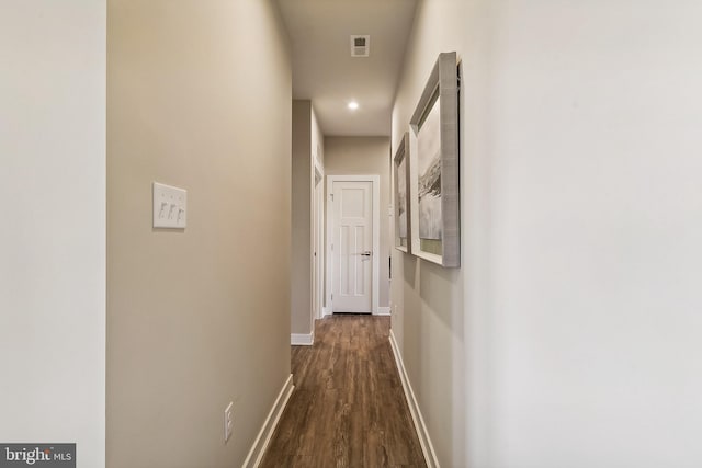 corridor with dark wood-type flooring