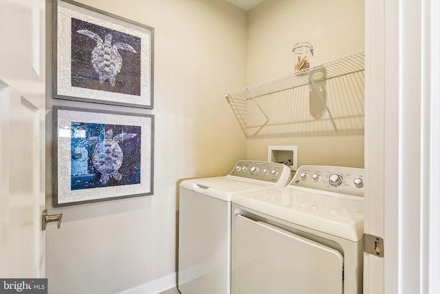 clothes washing area featuring independent washer and dryer