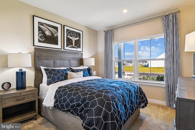 bedroom featuring light colored carpet