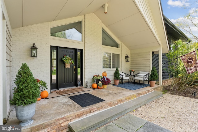 doorway to property featuring a patio area