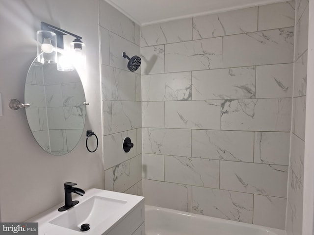 bathroom featuring vanity and tiled shower / bath combo