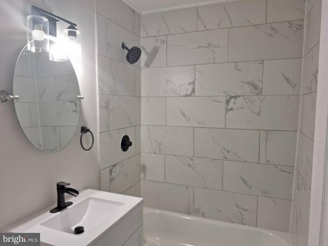 bathroom featuring vanity and tiled shower / bath combo