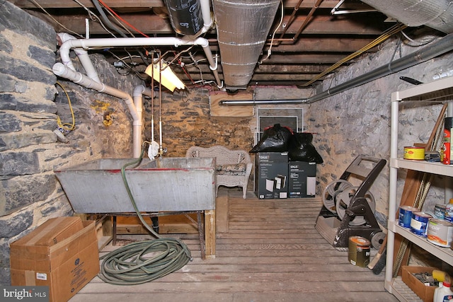 basement with wood-type flooring