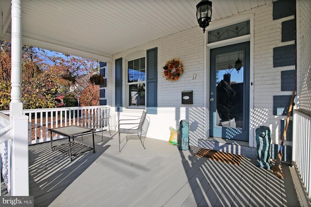 wooden deck featuring a porch