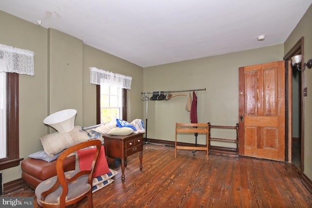 sitting room featuring dark wood-type flooring