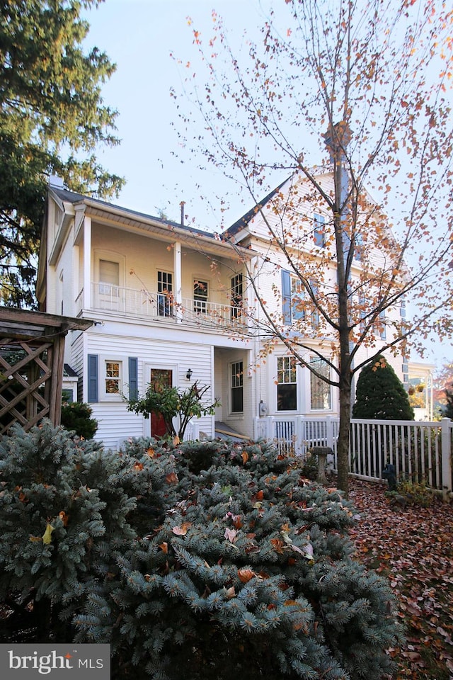 rear view of property with a balcony