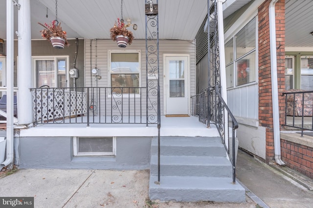 property entrance featuring covered porch