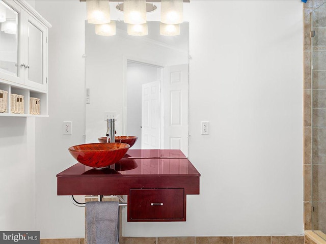 bathroom with a tile shower