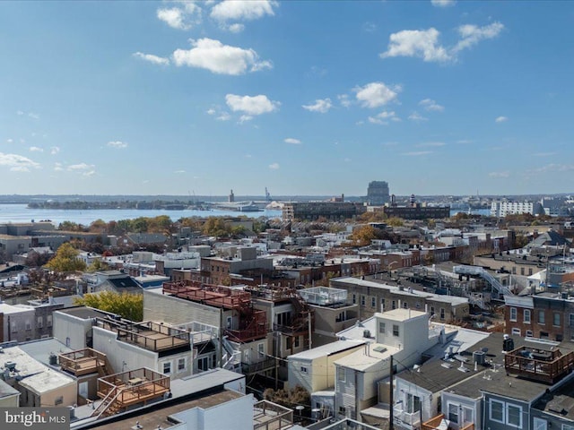 bird's eye view featuring a water view and a view of city