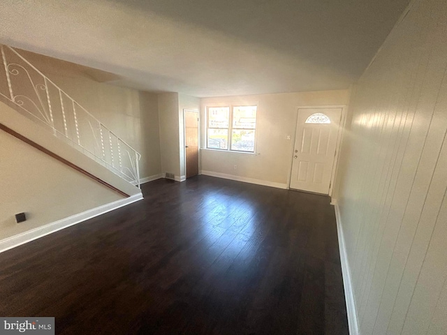 foyer with dark wood-type flooring