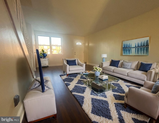 living room with dark hardwood / wood-style flooring