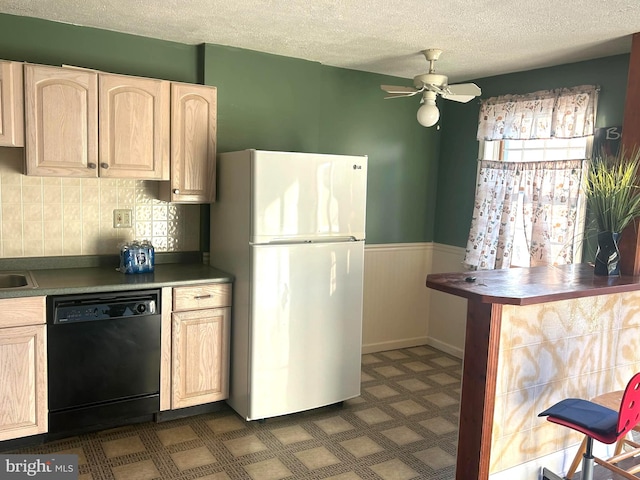 kitchen with ceiling fan, white fridge, a textured ceiling, and black dishwasher