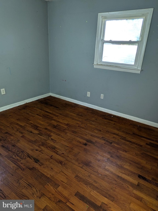 empty room featuring dark hardwood / wood-style floors