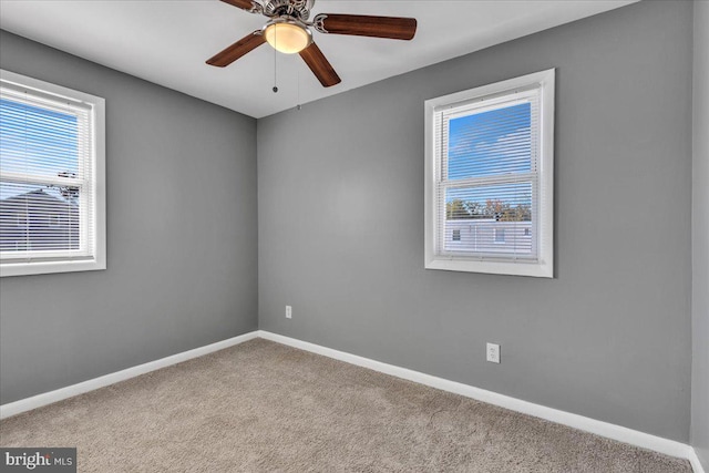 carpeted empty room with ceiling fan