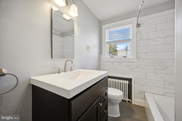 bathroom with tile walls, vanity, toilet, and radiator