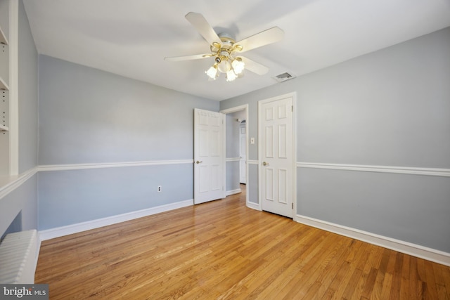 unfurnished room featuring ceiling fan and light hardwood / wood-style flooring