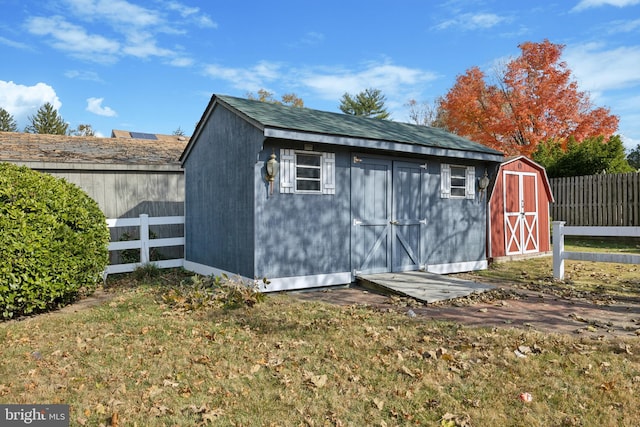 view of outbuilding with a yard