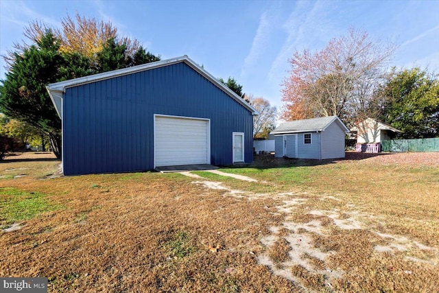 garage with a lawn