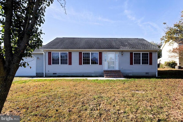 ranch-style house featuring a garage and a front lawn