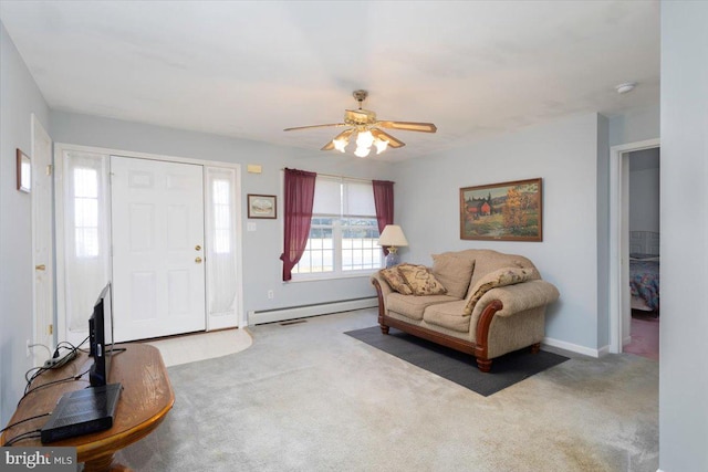 interior space featuring baseboard heating, light carpet, and ceiling fan