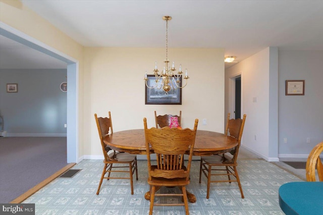 dining room with a notable chandelier