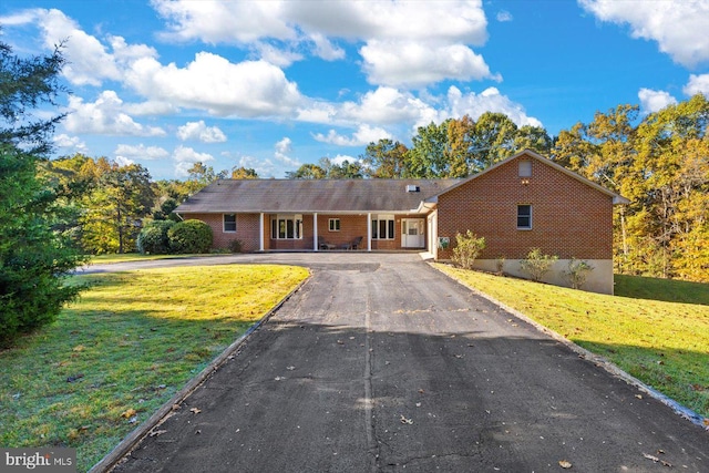 ranch-style home with a front lawn