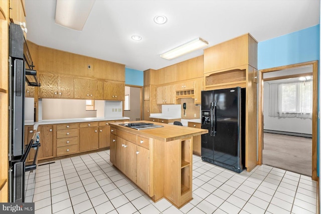 kitchen with black refrigerator with ice dispenser, stainless steel gas stovetop, butcher block counters, light colored carpet, and a center island